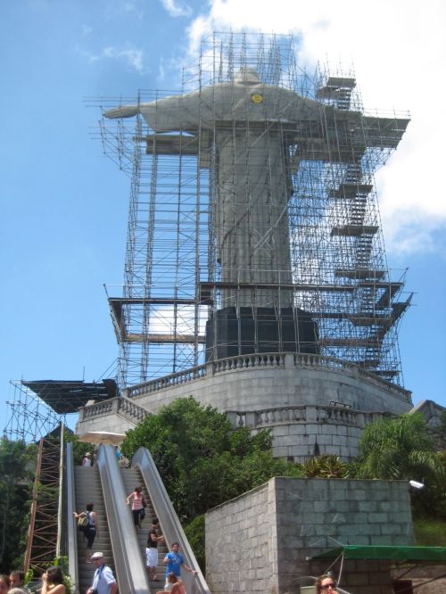 Visitors utilize a train, elevators/stairs, and an escalator to access the nearly 80 year-old statue